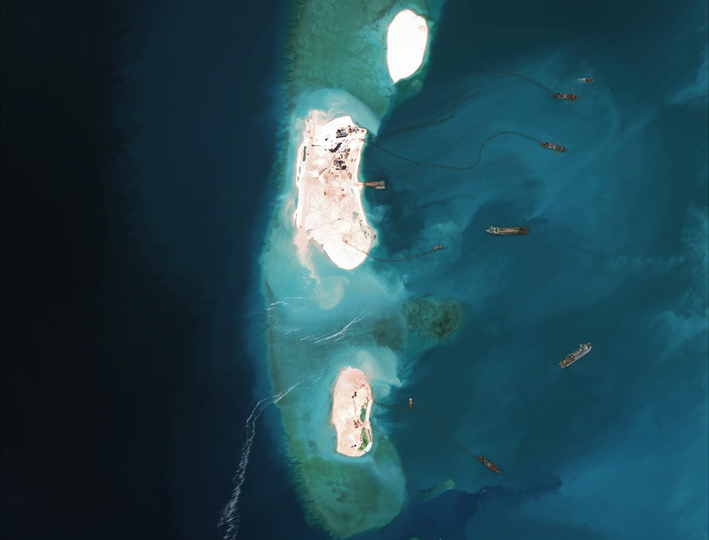 Illustration for article titled Incredible Satellite Images Show China Building Artificial Archipelago
